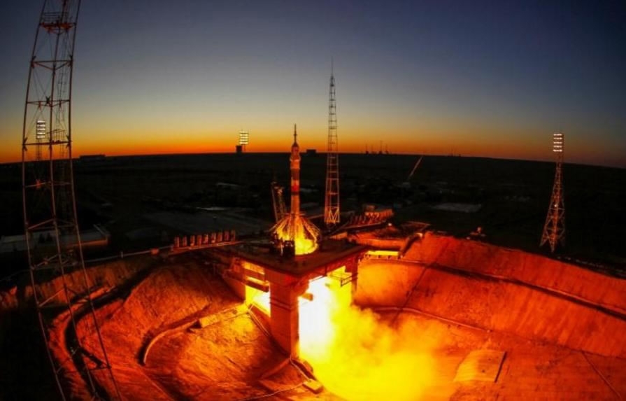 Three astro<em></em>nauts reach space station with Russian space caps Three astro<em></em>nauts reach space station with Russian space caps