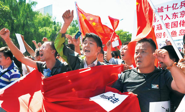 全国20多个城市举行反日游行的英文报道 全国20多个城市举行反日游行的英文报道