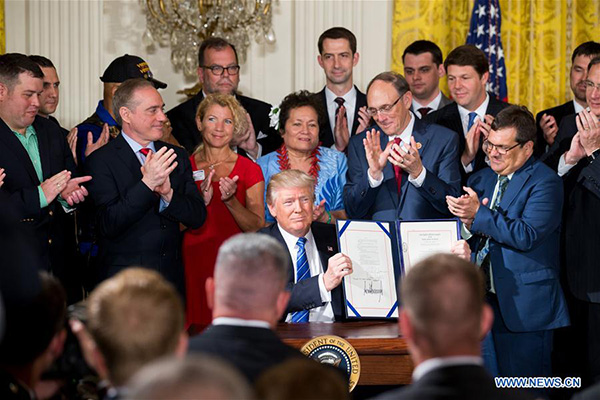 Trump signs new law to protect whistleblowers at Department Trump signs new law to protect whistleblowers at Department
