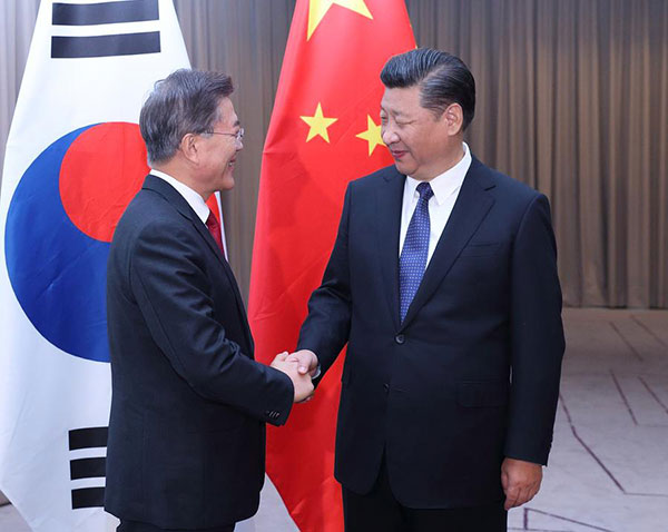 Xi insists on peaceful resolution Xi insists on peaceful resolution