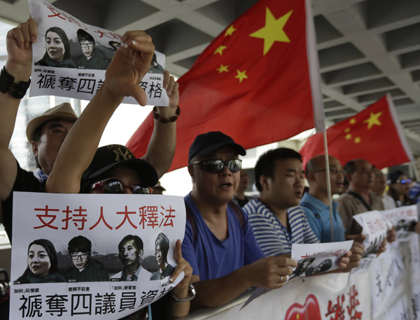 香港4名"辱国议员"被剥夺议员资格 香港4名"辱国议员"被剥夺议员资格