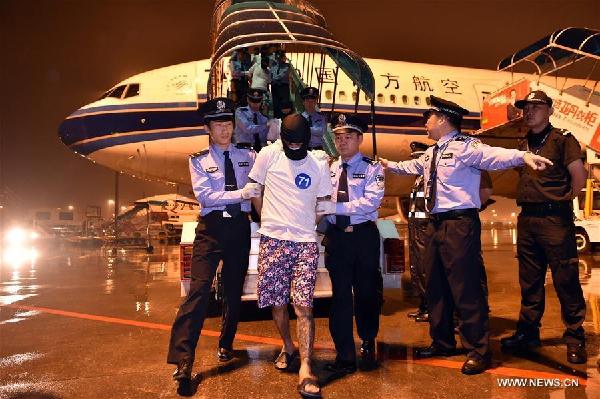 97 fraud suspects extradited from Malaysia to Mainland 97 fraud suspects extradited from Malaysia to Mainland